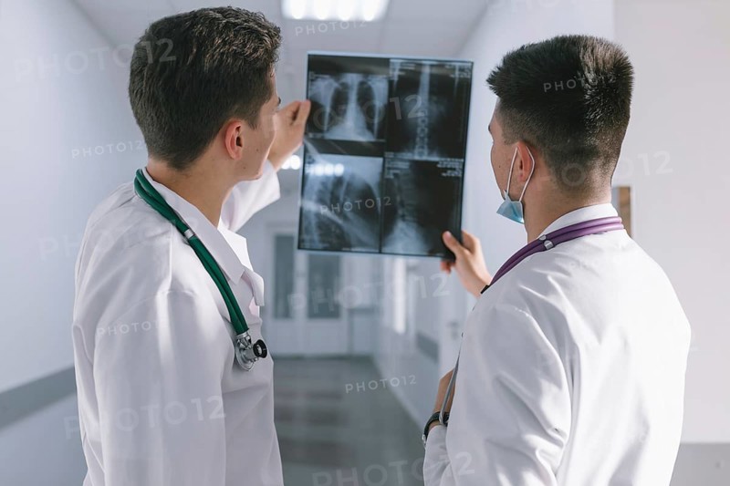 Two male doctors looking x ray. High resolution photo