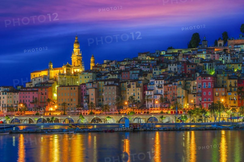 Old town architecture of Menton on French Riviera by night