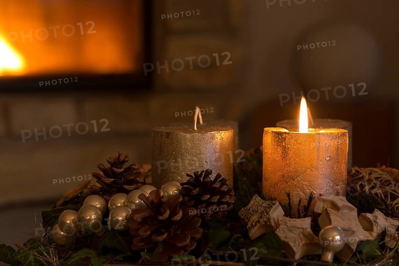 Burning candle on an Advent wreath