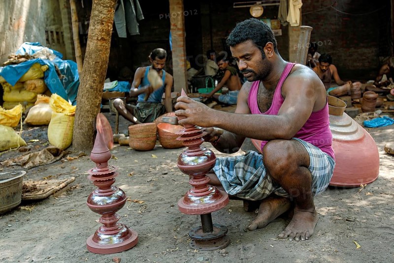 Engraver making copper gopura kalasam in Kumbakonam, Tamil Nadu, India, Asia
