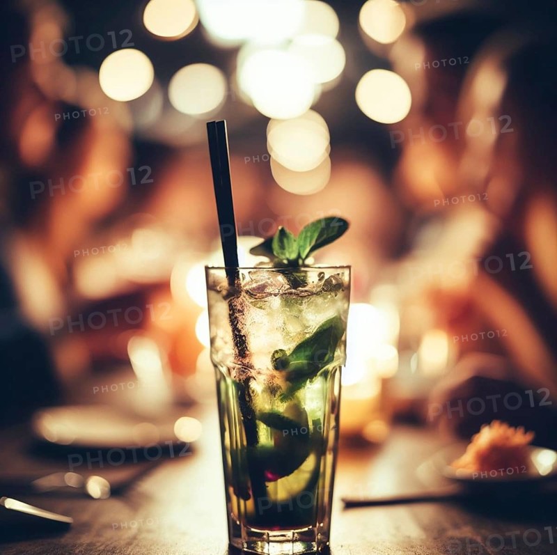 Illustration of a mojito cocktail drink in a bar pub at night, dim warm light, selective focus bokeh ai generated