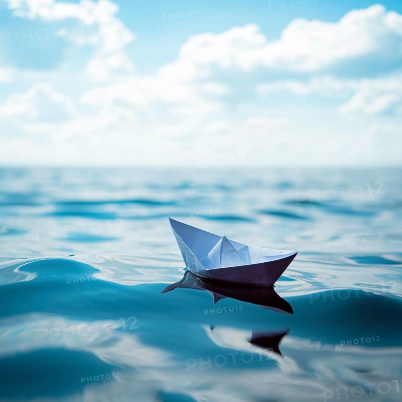 Paper ship at sea