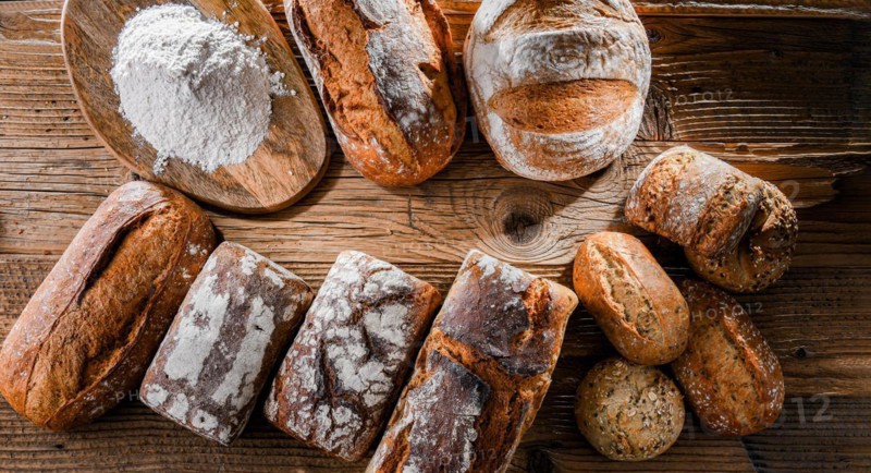 Composition with assorted bakery products on wooden table
