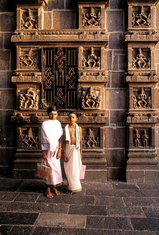 Dikshitar boys in front of karna sculptures in Thillai Nataraja temple in Chidambaram, Tamil Nadu, South India, India, Asia