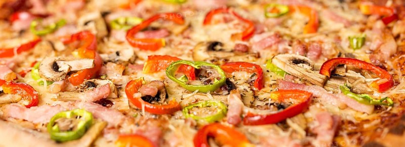 Close up pizza with red pepper ingredients