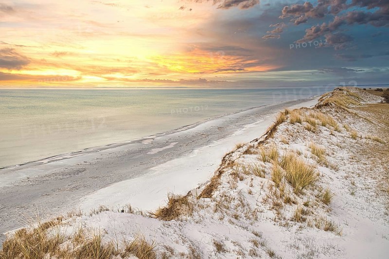 Dramatic sunset at the high dune on the darss. Viewpoint in the national park. Beach, Baltic Sea, sky and sea. Nature shot in Germany