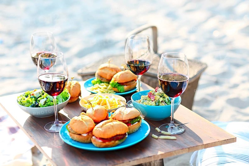 Beach summer picnic table with red wine glasses