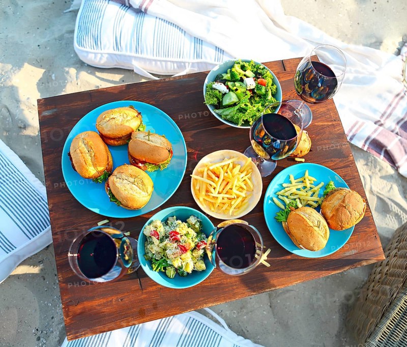 Beach summer picnic table with red wine glasses