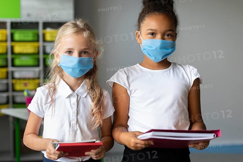 Little girls wearing medical masks class