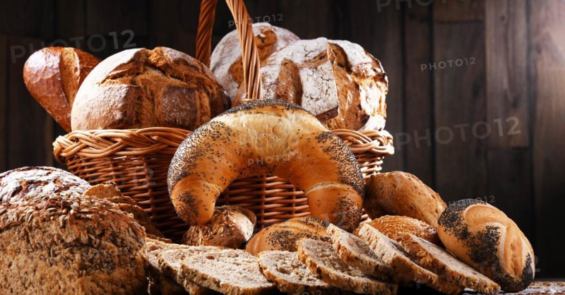 Assorted bakery products including loafs of bread and rolls