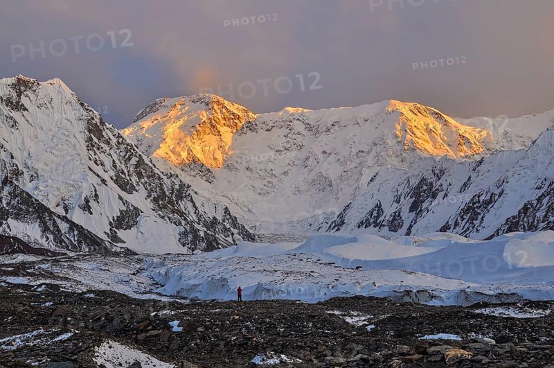 Inylcheck glacier in Kyrgyzstan with Pik Pobeda peak lit by early morning sun