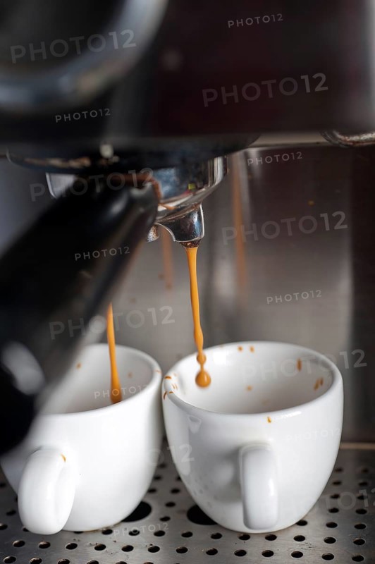 Italian espresso coffe making with professional machine macro