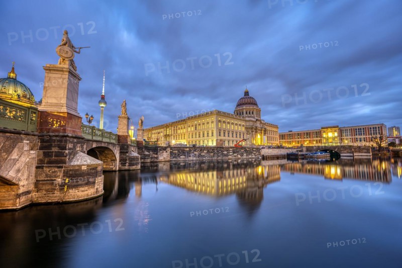 The rebuilt Berlin City Palace with the TV Tower at dusk