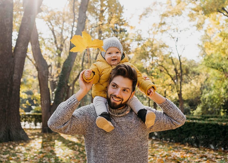 Smiley dad with his baby outside nature