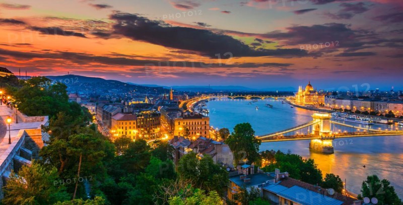 Panoramic view of Budapest with Hungarian Parliament Building on the bank of the Danube and Chain Bridge by night