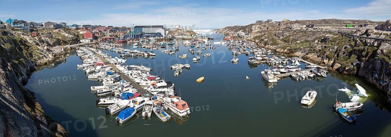 Ilulissat, Greenland, July 03, 2018: Panoramic view of the harbor in Ilulissat, North America