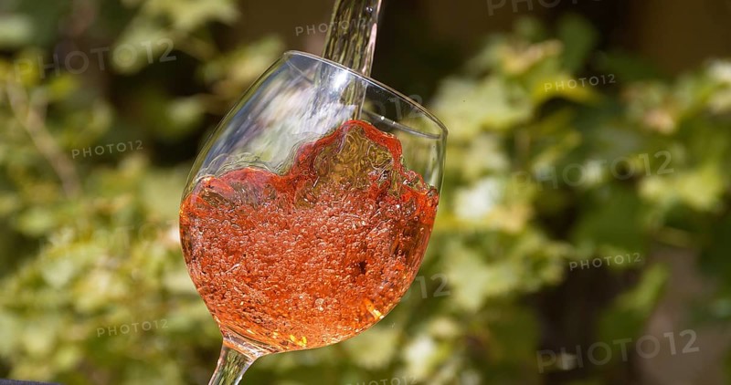 Pink Wine being poured into Glass