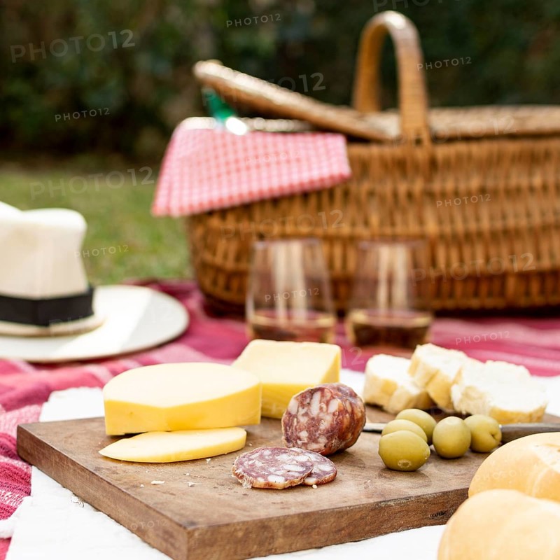 Wooden board with picnic goodies