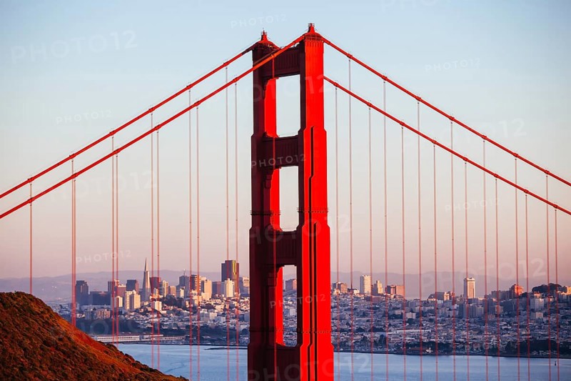 A view at dusk thru the Golden Gate Bridge towards downtown San Francisco. In California, USA, North America