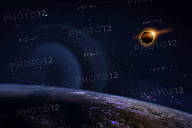 Solar eclipse with orange halo over the planet Earth, on dark starry sky. Elements of this image furnished by NASA