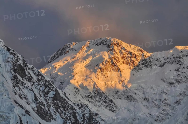 Scenic Pik Pobeda peak lit by early morning sun in Kyrgyzstan