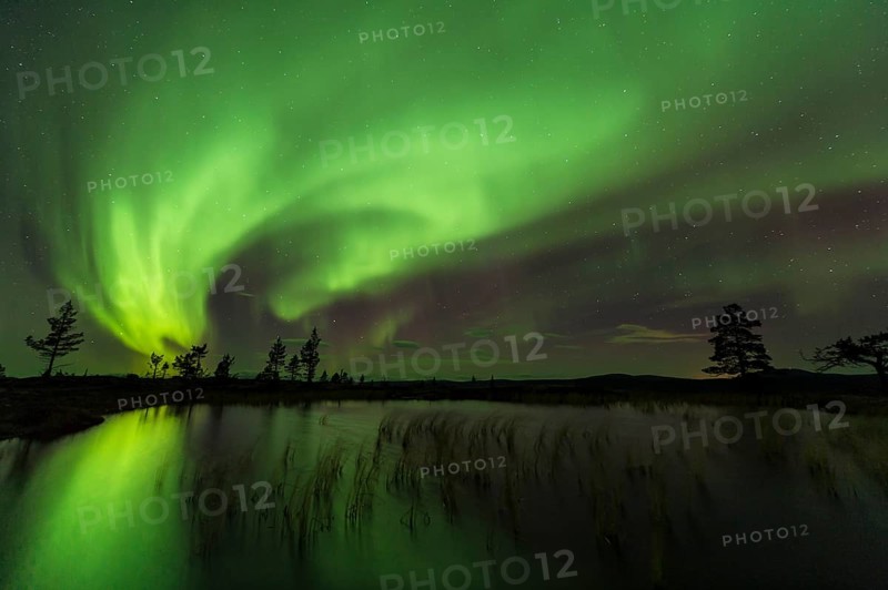Northern Lights (Aurora borealis) reflected in a mountain lake, Gällivare, Norrbotten, Lapland, Sweden, October 2013, Europe