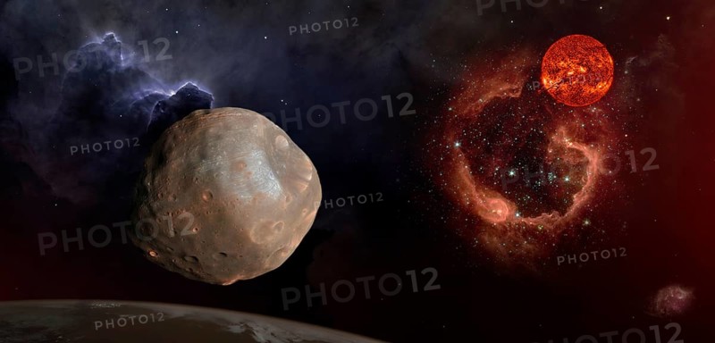 Fantasy composition of Phobos, the satellite of Mars. The old Sun shines over the RCW 79 nebula in the Centaurus constellation. Elements of this image furnished by NASA