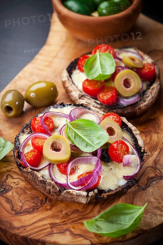 Giant Portobello mushrooms stuffed with mozzarella and tomatoes
