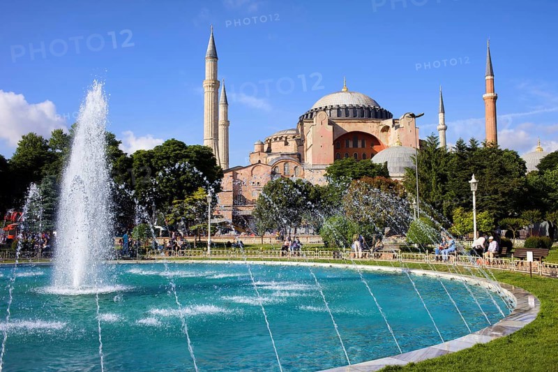 Byzantine architecture of the Hagia Sophia (The Church of the Holy Wisdom or Ayasofya in Turkish) and a park with fountain tranquil scenery in Istanbul, Turkey, Asia