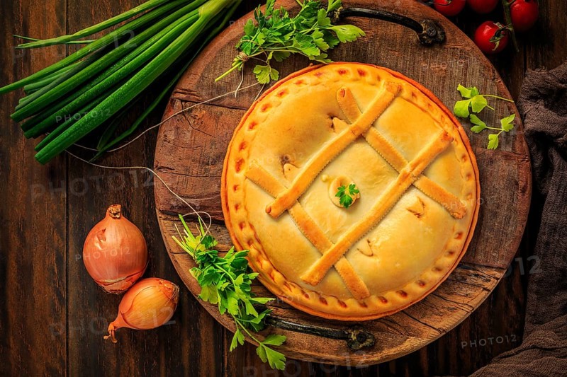 Empanada Gallega - traditional pie stuffed with tuna, Galician and Spanish cuisine. Tart with tuna and vegetables