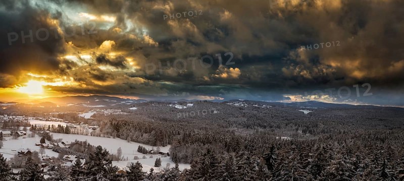 Sunset over the snowy winter landscape near Neuschönau, Bavaria, Germany, Europe
