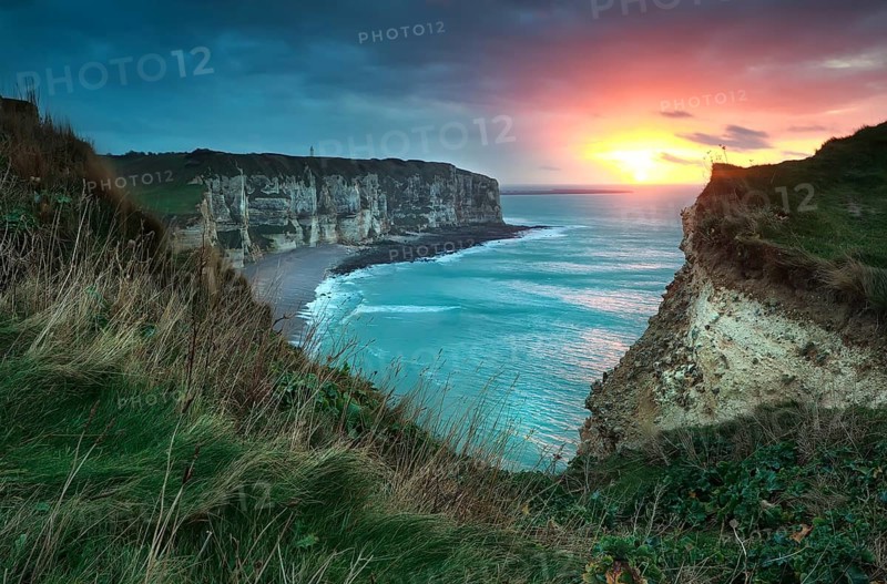 Warm sunset over cliffs and ocean, Etretat, France, Europe