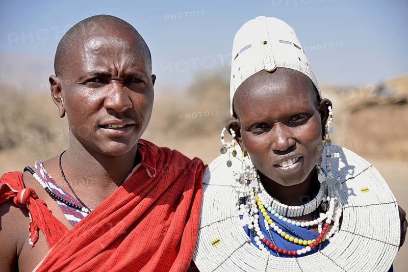 Maasai man and a woman wearing traditional dress, Ngorongoro Conservation Area, Ndema, Tanzania, Africa