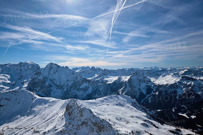 View of a ski resort piste and Dolomites mountains in Italy from Passo Pordoi pass. Arabba, Italy, Europe