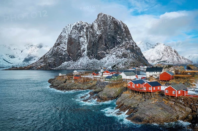 Hamnoy fishing village with red rorbu houses in Norwegian fjord in winter. Lofoten Islands, Norway, Europe