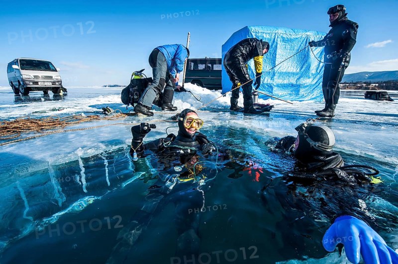 Scuba divers after an ice dive, Lake Baikal, Pribaikalsky National Park, Irkutsk Province, Siberia, Russia, Europe