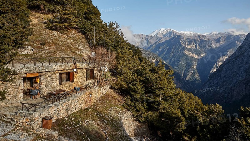Entrance to the gorge, entrance, ticket office in the rock, terrace, snow-capped mountains, Xyloskalo, Samaria Gorge, Omalos, Lefka Ori, White Mountains, West Crete, island of Crete, Greece, Europe