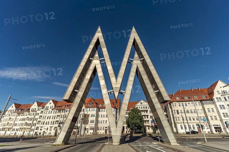 The huge double-M logo of the Leipzig Trade Fair Centre at the East Gate of the Old Leipzig Trade Fair Centre in Leipzig, Saxony, Germany, Europe