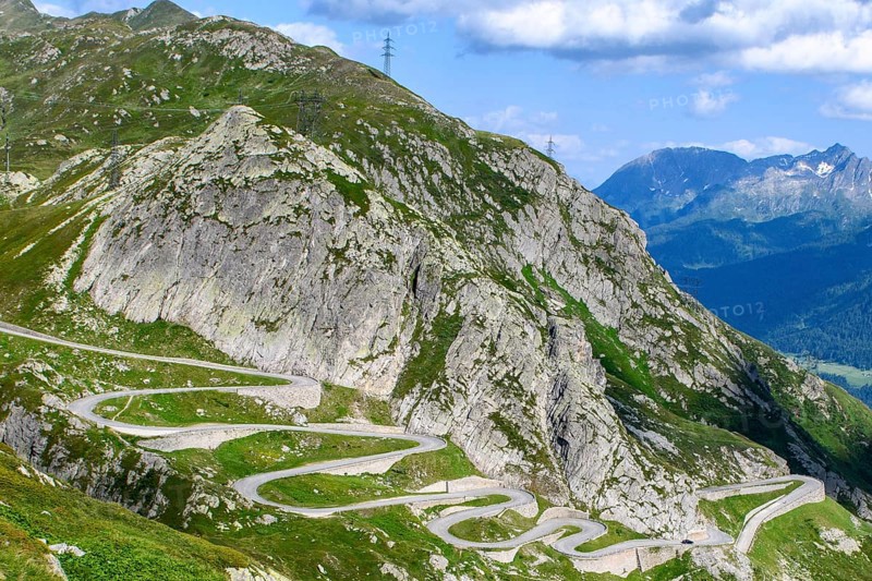 Steep mountain slope in the Gotthard massif, in the foreground serpentines hairpin bends winding mountain road Alpine pass section of historic Gotthard Pass Saint Gotthard Passo San Gottardo Tremola with cobblestones, Airolo, Ticino, Canton Ticino, Switzerland, Europe