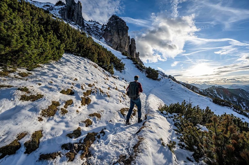Hikers on a hiking trail with snow, ascent to Kramerspitz, in autumn, Ammergau Alps, Bavarian Prealps, Bavaria, Germany, Europe