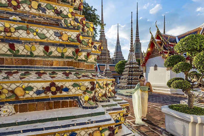 Wat Pho Temple is Bangkok's oldest Buddhist monastery near the Grand Palace. Four chedis are among the most precious in Bangkok. Temple dancer. Bangkok, Thailand, Asia