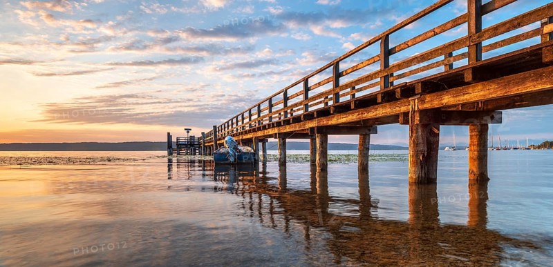 Morning atmosphere at the Lake Ammer, jetty in the first morning light, near Riederau, Bavaria, Germany, Europe