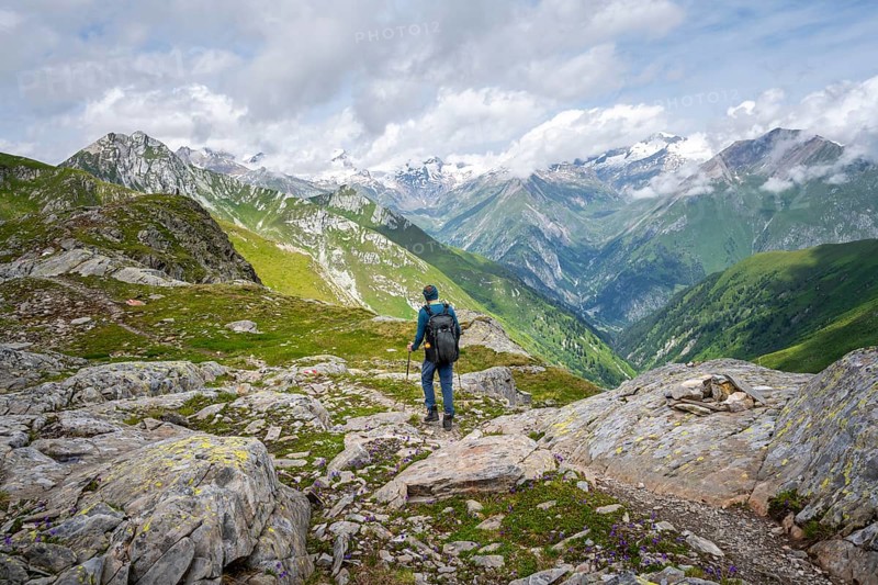 Mountaineers on a hiking trail on the Mittagskögele, view of mountain peaks of the Venediger group and the Lasnitzental valley, Lasörling Höhenweg, Lasörling group, Hohe Tauern National Park, East Tyrol, Tyrol, Austria, Europe
