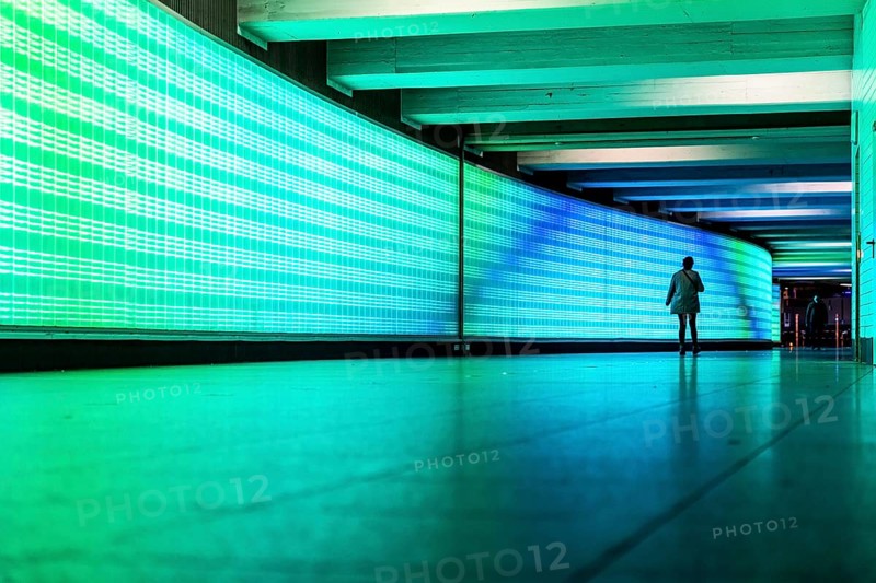 Passage under Essen's main railway station, connects entrances to the city and the main railway station, with the underground station, illuminated, LED wall, few people, Germany, Europe