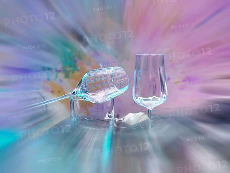 Light art, various glasses on silver foil, behind them various splashes of colour, zoom effect, studio shot