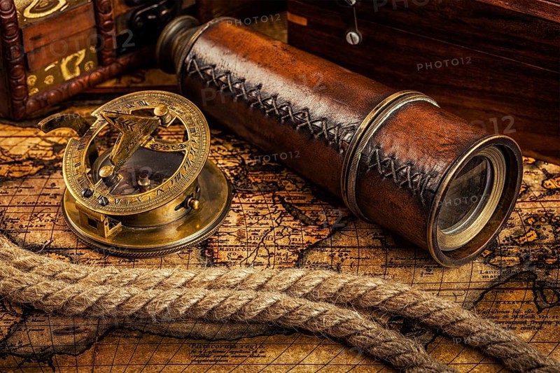 Travel geography navigation concept background, old vintage retro compass with sundial, spyglass and rope on ancient world map