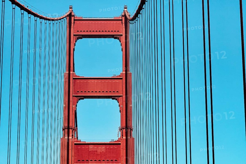 Orange pylon and steel cables of the suspension bridge, detail, Golden Gate Bridge, blue sky, San Francisco, California, USA, North America