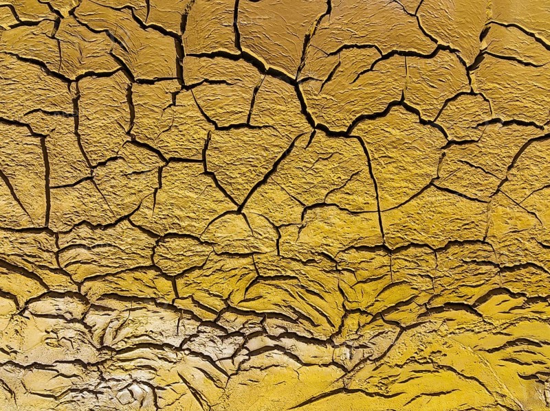 Mineral-rich cracked earth at the bank of the Rio Tinto (Red river), aerial view, drone shot, Huelva province, Andalusia, Spain, Europe
