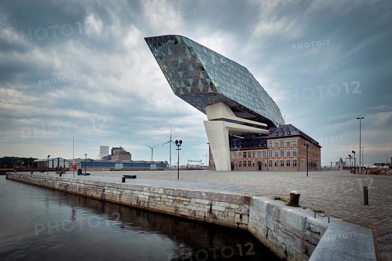 ANTWERP, BELGIUM, MAY 27, 2018: Antwerp port administration headquarters, designed by famous iranian architect Zaha Hadid, Antwerpen, Belgium which was her last project in stormy weather