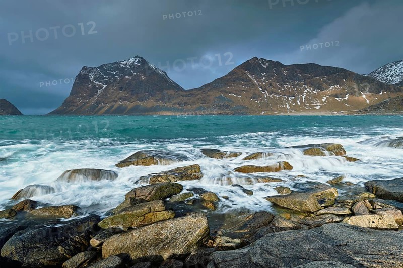 Rocky coast of fjord of Norwegian sea in winter. Lofoten islands, Norway, Europe